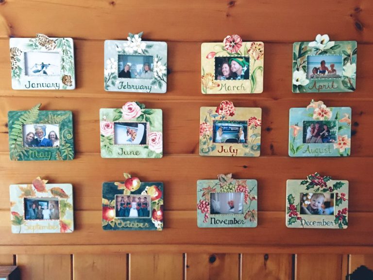 A monthly photo frames display wall is a fun way to USE YOUR PHOTOS! Display your favorite photo from each month and change them (or not) every year.